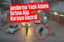 Yaşlı adamı sırtına alıp karşıya geçirdi