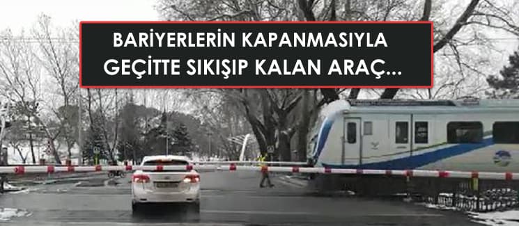 Bariyerler kapanınca sıkışıp kalan araç...