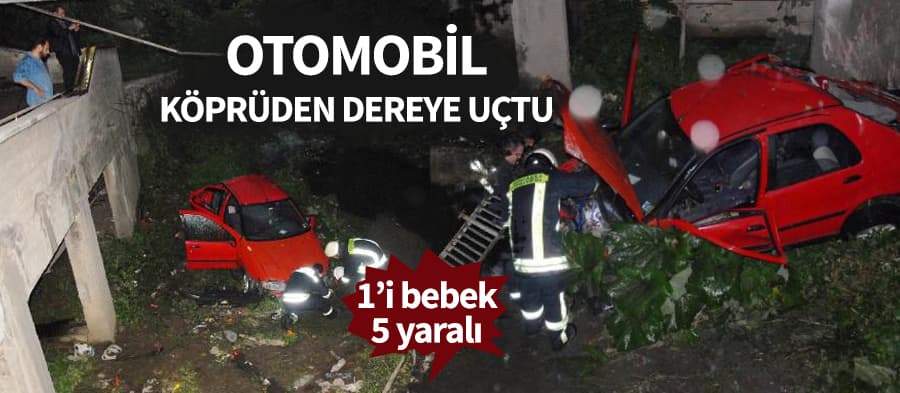 Otomobille 8 metre yükseklikten düştüler