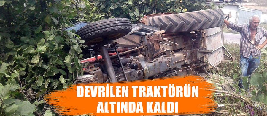 Devrilen traktörün altında kaldı