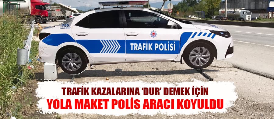 Kazalara 'dur' demek için yola maket polis aracı koydular