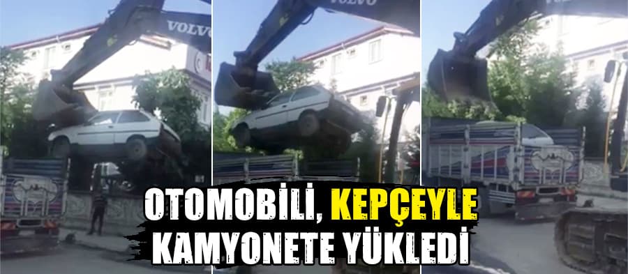 Otomobili kepçeyle kamyonetin kasasına yükledi