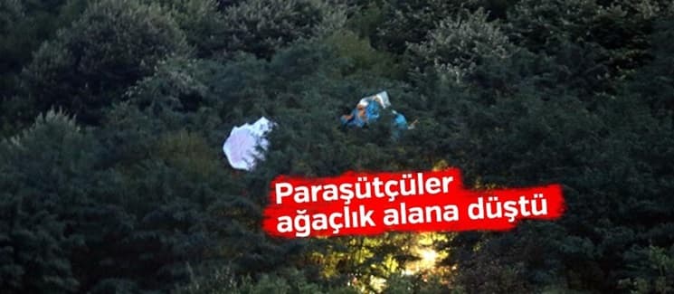 Yamaç paraşütçüleri ağaçlık alana düştü